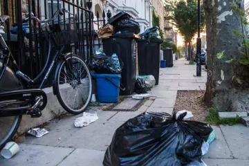 a street with trash bags