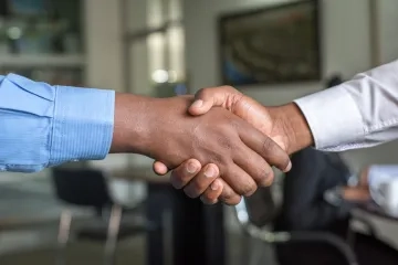 Photo of shaking hands by Cytonn Photography on Unsplash