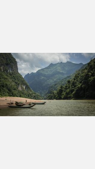 Canoes on a riverbank