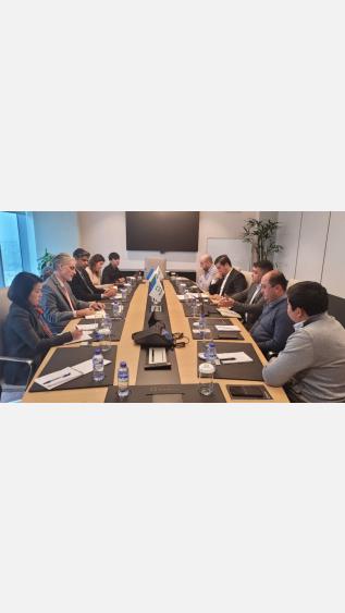 GGGI Uzbekistan and Agrobank representatives sitting at a table on a meeting regarding the green bond issuance