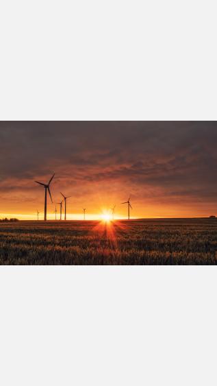 Photo of wind turbines by Karsten WÃ¼rth on Unsplash